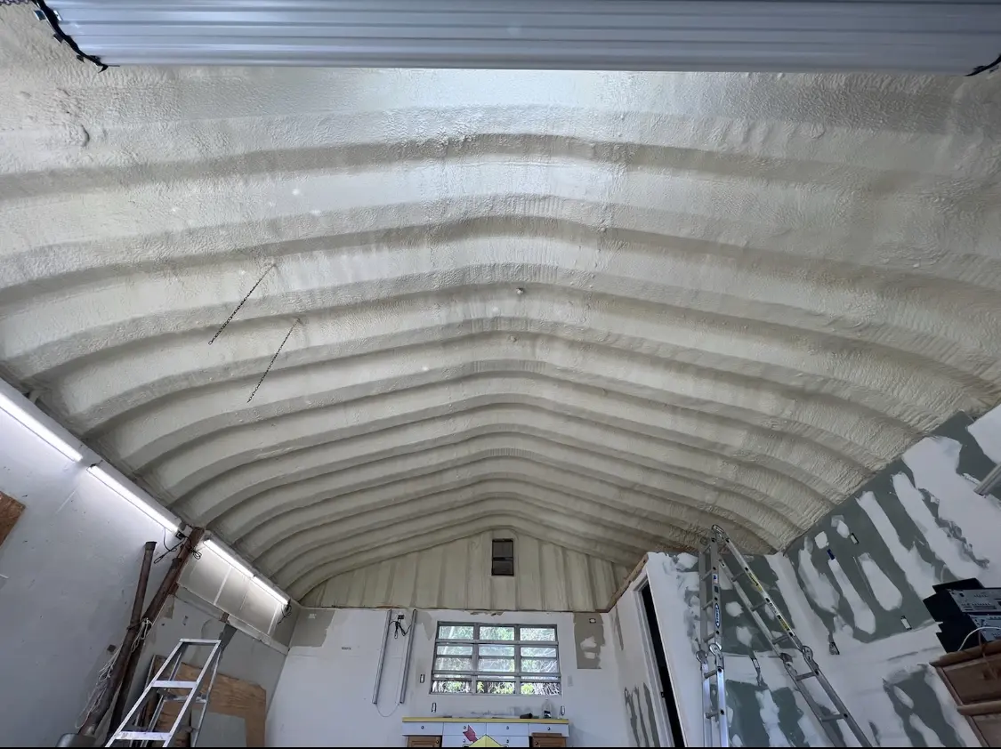 Spray polyurethane foam applied to the underside of a metal roof deck in Edgewood